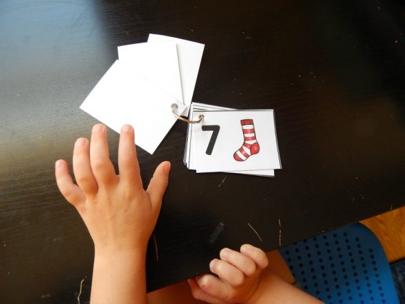 child using number cards