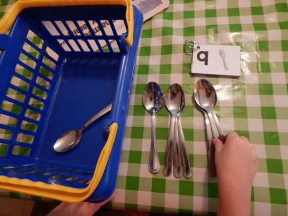 child counting spoons