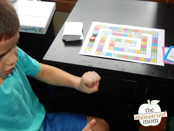 child playing subtraction game